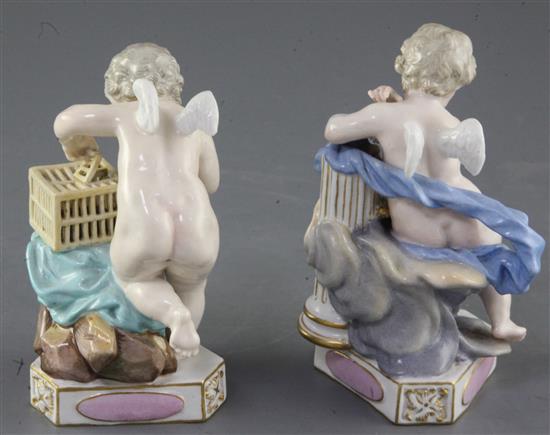 A pair of Meissen figures of Cupids, 19th century, height 11.8cm and 12.5cm